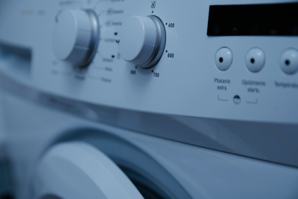 Close-up of the control knobs on a washing machine